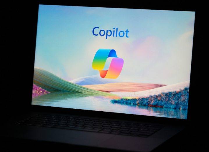 The Microsoft Copilot logo on the front of a laptop screen.