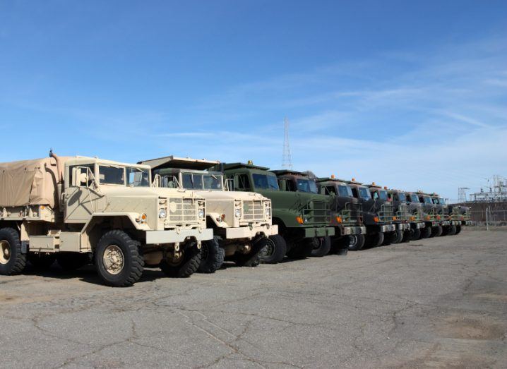 A fleet of trucks lined up together.