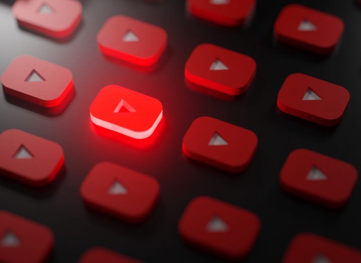 Many YouTube logos with one of them glowing in red.