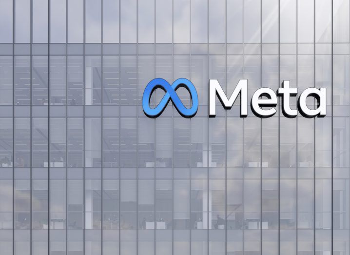 Meta logo on a glass building.