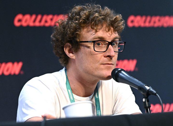 Photo of Paddy Cosgrave, CEO and co-founder of Web Summit, speaking into a mic.