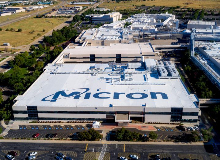 A large building with the Micron logo on the roof.