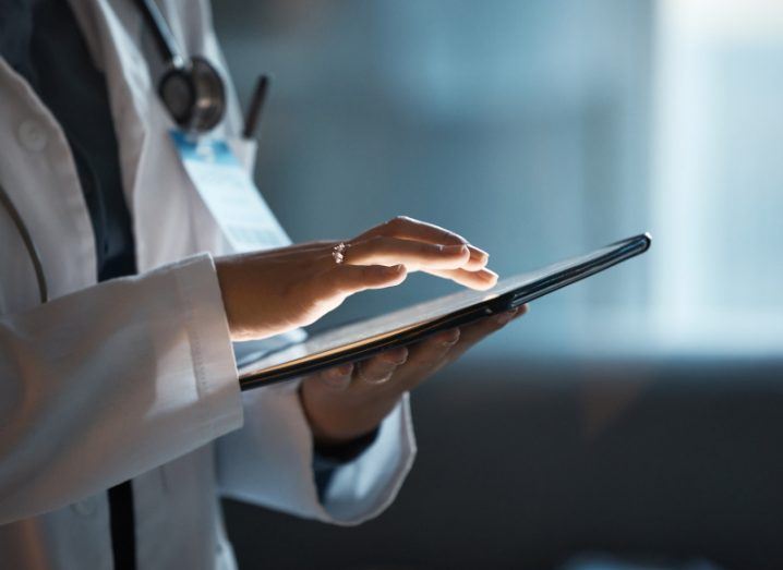 A doctor using a digital tablet. Used as a concept for a doctor using the Clanwilliam Pippo app.