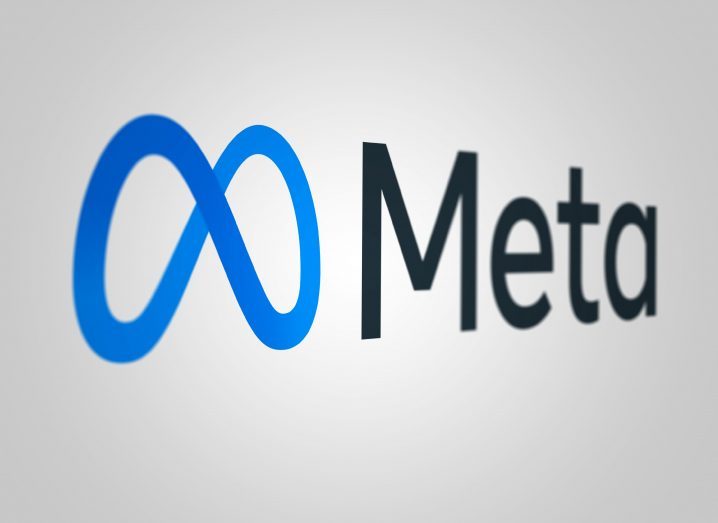 Meta logo on a grey-white background.
