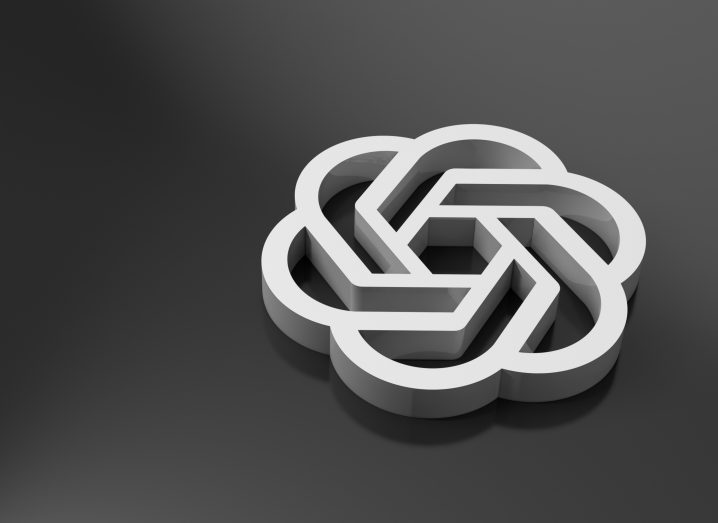 The OpenAI white logo against a black backgroound.