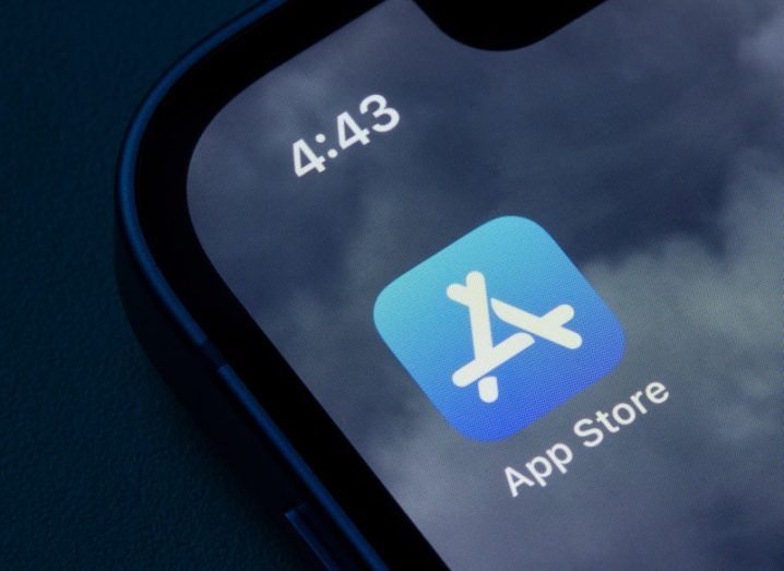 Apple App Store logo on a smartphone screen.