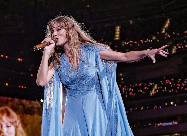 Photo of Taylor Swift singing on stage.